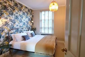 Säng eller sängar i ett rum på Lovely 2-bedroom apartment in Shoreditch