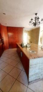 a kitchen with a counter with a sink in it at Sun view in Nelspruit