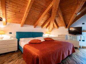 Postel nebo postele na pokoji v ubytování Hotel Benacus Panoramic