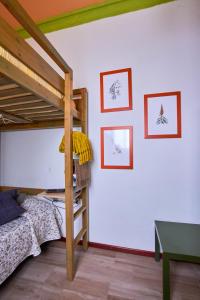 a bedroom with two bunk beds and a table at Studio Plaza Farray in Las Palmas de Gran Canaria