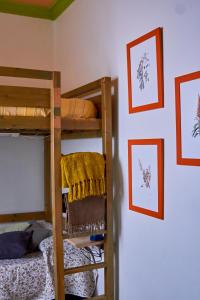 a bedroom with two bunk beds and pictures on the wall at Studio Plaza Farray in Las Palmas de Gran Canaria