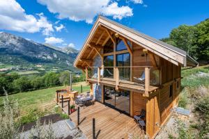 a house on a hill with a view at Les chalets d'Éléna in Saint-Jean-Saint-Nicolas