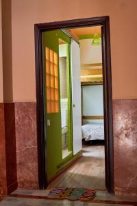 a mirror in a room with a bed in a bedroom at Studio Plaza Farray in Las Palmas de Gran Canaria