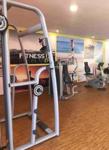 a gym with two tread machines and a treadmill at Superbe appartement à mohammadia in Mohammedia