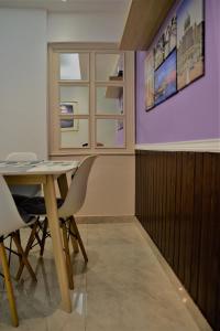 a dining room with a table and a window at Awedee Homestay Putrajaya in Putrajaya