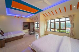 Postel nebo postele na pokoji v ubytování Veggies Residency + 25 fotografií