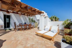 Khu vực ghế ngồi tại Ático Costa Ballena playa infante. 1º línea playa