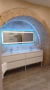 a bathroom with a sink and a mirror at CARLO DI BORBONE - Casa Vacanze- in Fornelli