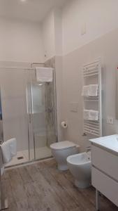 a bathroom with a shower and a toilet and a sink at CARLO DI BORBONE - Casa Vacanze- in Fornelli