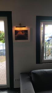 a living room with a couch and a window at Ferienhaus Hafen 17 in Hörstel
