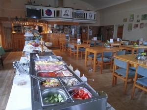 Reštaurácia alebo iné gastronomické zariadenie v ubytovaní Bušeranda - depandance Hotelu U Zeleného stromu