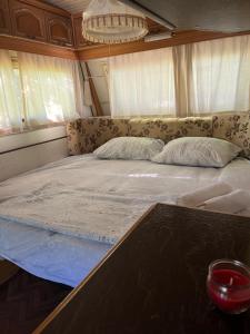Postel nebo postele na pokoji v ubytování KAMP-PRIKOLICA