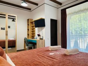 Rúm í herbergi á Pesvebi Design Hotel and Cellar