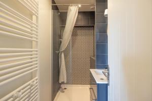 a small bathroom with a shower and a sink at St Gervais Les Bains - Mont Blanc in Saint-Gervais-les-Bains +14 photos