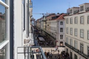 a view of a city street from a window at Nomad's Downtown Lisbon - Rua Augusta in Lisbon