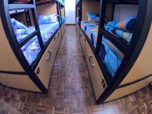 a group of bunk beds in a room at Nairobi Backpackers Hostel in Nairobi