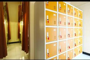 a wall of lockers in a room at Pondok Backpacker City Square Malang in Bunul