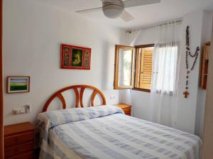 Llit o llits en una habitació de Dúplex frente al mar en La Manga del Mar Menor