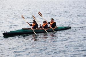 a group of people in a boat on the water at Ferienwohnung Schlossterrassen 4b in Pouch