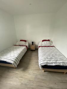 Voodi või voodid majutusasutuse Les gîtes plehedelais BIS toas