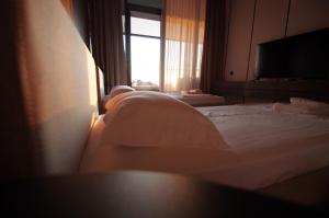 Postel nebo postele na pokoji v ubytování Hotel Nobilis Hall