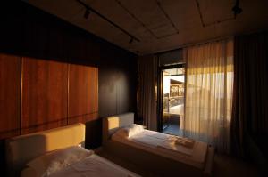 a small bedroom with two beds and a window at Hotel Nobilis Hall in K'obulet'i +37 photos
