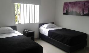 Uma cama ou camas num quarto em Hotel Onix T