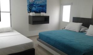 Uma cama ou camas num quarto em Hotel Onix T