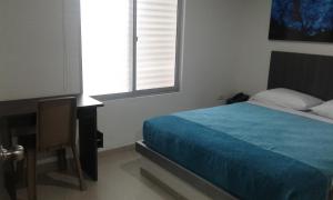 Uma cama ou camas num quarto em Hotel Onix T