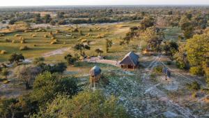 an aerial view of a farm with two huts at Chobe Hideaway 