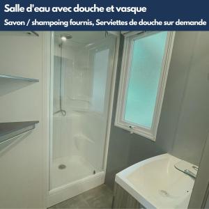 a white bathroom with a shower and a sink at Le Riesling - Mobilhome pour 6 - TV - Climatisé in Boofzheim
