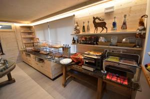 Cucina o angolo cottura di Hotel Cime D'Oro