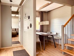 a dining room and living room with a table and chairs at leaf in Kirchheim