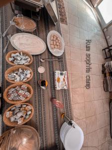 a kitchen with baskets of food on the floor at Rum Sophia camp in Wadi Rum