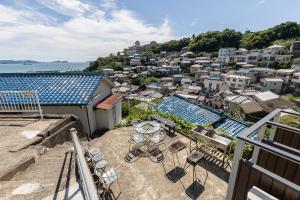 a view of a city from a balcony of a building at 和歌浦Poseidon家族団体専用個室 in Wakayama