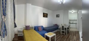 a small room with a bed and a couch at Adam's Apartment 2 in Kladovo