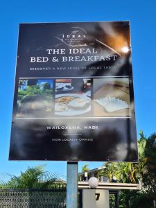 a billboard sign for the dead bed and breakfast at The Ideal Bed & Breakfast in Nadi