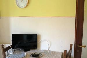 TV a/nebo společenská místnost v ubytování Appartamento Jimmy