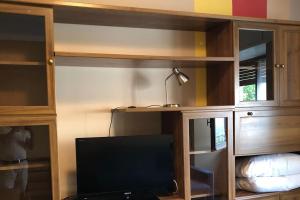 TV a/nebo společenská místnost v ubytování Appartamento Jimmy
