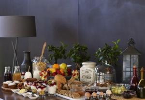 a table with food and other foods on it at Leivatho Hotel in Svoronata