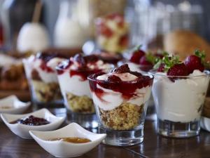 a group of desserts in glasses on a table at Leivatho Hotel in Svoronata