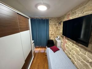 Voodi või voodid majutusasutuse Appartement « Le Jardin du Luxembourg » toas