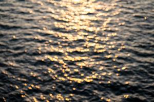 an image of the sun reflecting on the water at Castelbrac Hotel & Spa in Dinard