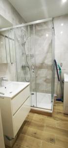 a bathroom with a shower and a sink at Zrekonštruovaný byt s výhľadom na tichom mieste in Púchov