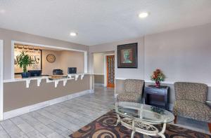 a lobby with a waiting room with chairs and a table at Super 8 by Wyndham Somerset in Somerset