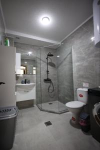 a bathroom with a shower and a toilet and a sink at Enjoy Apartments Prilep in Prilep +32 photos