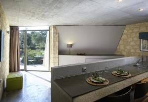 a kitchen with a counter with a sink and a counter sidx sidx sidx at Leivatho Hotel in Svoronata