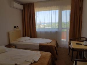 Кровать или кровати в номере Hotel Petrolul