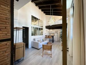 Apartamentos Puerta Elvira Suites 3000客房内的一张或多张床位