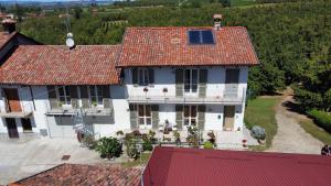an aerial view of a white house with red roofs at Cà di Gat in La Morra
